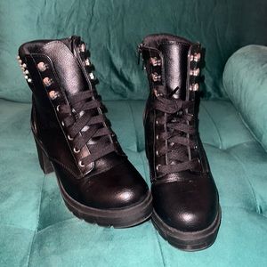 Black combat boots with silver studs